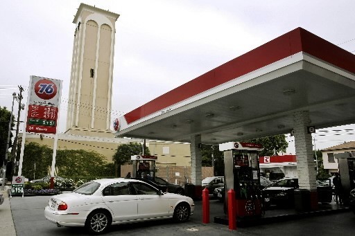MOTORISTS stop for gasoline in Los Angeles, at a 76 station at Pico Boulevard and Oakhurst Drive. Next door, concealed by the beige tower, is an oil-drilling operation. With crude oil soaring above $140 per barrel, the state is eyeing its old wells, including thousands in L.A. / MOTORISTS stop for gasoline in Los Angeles, at a 76 station at Pico Boulevard and Oakhurst Drive. Next door, concealed by the beige tower, is an oil-drilling operation. With crude oil soaring above $140 per barrel, the state is eyeing its old wells, including thousands in L.A. /