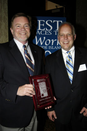 PBN Publisher Roger Bergenheim(r) presents Anthony Maione, Executive Director for United Way of RI, with their award. / PBN Photo/Frank Mullin