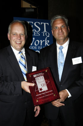 PBN Publisher Roger Bergenheim(l) presents Steven Deware, of Starkweather &amp; Shepley Insurance, with their award for winning in the Medium Category. / PBN Photo/Frank Mullin