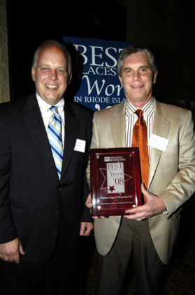 Gary Pannone(r), of Pannone, Lopes &amp; Devereaux LLC, accepts the award for recognition in the Small Category from PBN Publisher Roger Bergenheim. / PBN Photo/Frank Mullin