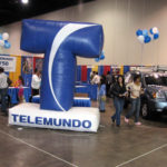 VISITORS check out Hispanic businesses featured at a business expo in Providence last year that was sponsored by WRIW Telemundo Providence. / 
