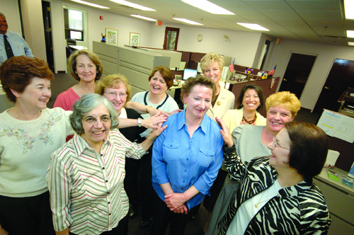 Jean Brown, center in the blue shirt, has been with Starkweather for 37 years - one of eight three-decade employees at the firm. / Jean Brown, center in the blue shirt, has been with Starkweather for 37 years - one of eight three-decade employees at the firm. /
