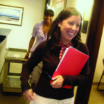FACILITIES COORDINATOR Tracy Brooks follows Nixon Peabody attorney Elizabeth Oliveira through the halls of the firm&rsquo;s Providence office in Citizens Plaza. / 