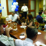 Partridge Snow & Hahn employees gather in the firm's library to celebrate being named one of Rhode Island&rsquo;s best places to work. / 