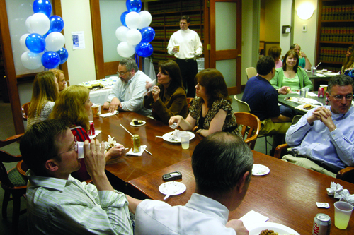 Partridge Snow & Hahn employees gather in the firm's library to celebrate being named one of Rhode Island’s best places to work. / Partridge Snow & Hahn employees gather in the firm's library to celebrate being named one of Rhode Island’s best places to work. /