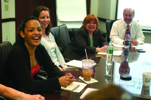 Gleda Delgado, left, laughs following a role-playing excercise at Kahn, Litwin, Renza & Co. / Gleda Delgado, left, laughs following a role-playing excercise at Kahn, Litwin, Renza & Co. /