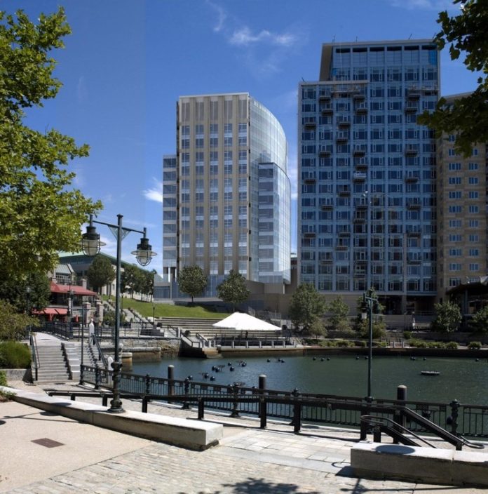 BLUE CROSS & BLUE SHIELD of Rhode Island's new headquarters, shown here in a rendering, is designed to fit into other Capital Center buildings, including the Waterplace Towers at right. / 