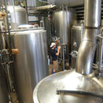 Brewers hop into Ocean State waters NO TROUBLE BREWING: Adam Truesdale, an employee at Coastal Extreme Brewing Co. in Middletown, checks the progress of
fermentation. /