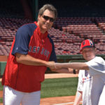 ON DECK: Dave Magadan, hitting coach for the Boston Red Sox, celebrates with 12-year-old Michael Coyne, a player on the Cumberland Challengers Little League Team, after a stint in the outdoor batting cage at Fenway Park during CVS Caremark All Kids Can Camp. / 