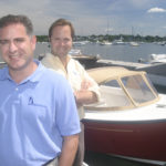 Bristol boat builder navigates rough economic waters BRISTOL HARBOR GROUP Vice President Cory Wood, left, and President Greg Beers pose with a Bristol Harbor 19cc. /