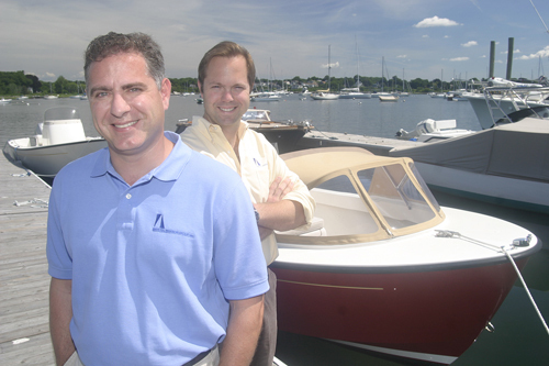 BRISTOL HARBOR GROUP Vice President Cory Wood, left, and President Greg Beers pose with a Bristol Harbor 19cc. / BRISTOL HARBOR GROUP Vice President Cory Wood, left, and President Greg Beers pose with a Bristol Harbor 19cc. /