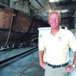 HOPE FLOATS: Holby Marine Co. owner W. Barrett Holby Jr., shown here in the firm&rsquo;s production area, said that slowing sales of the 
17-foot Bristol Skiff often serve as a harbinger of a slumping stock market. / 