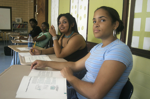 HOPE HIGH graduates, front to back, Stephania Cruz, Jennifer Nunez, Lorpu Dolo and Stephen Lawson listen during a job-training class designed to prepare them for work in the hospitality and tourism sector and customer service. / HOPE HIGH graduates, front to back, Stephania Cruz, Jennifer Nunez, Lorpu Dolo and Stephen Lawson listen during a job-training class designed to prepare them for work in the hospitality and tourism sector and customer service. /