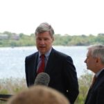 U.S. SEN. SHELDON WHITEHOUSE, pictured here speaking next to Narragansett Bay with colleague Sen. Jack Reed in the spring, held a hearing in Narragansett that accepted testimony about the potential effects on Rhode Island's shoreline of climate change. / 