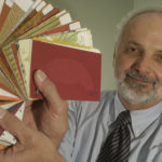 PAPER CHAMPION: Paul DeFruscio shows off samples of the tree-free paper he is hoping to sell to jewelry and box manufacturers for eco-friendly packaging. / 