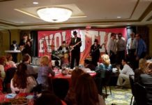 TOP PERFORMERS: BankNewport CEO Tom Kelly, left, on guitar, and CFO Andy Hewitt, center, on bass guitar, entertain at an April event for employees. / 