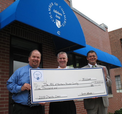 MICHAEL ANDRADE, of The Arc of Northern Bristol County, center, accepts a $5,000 check from Attleboro Area Chamber of Commerce President Jack Lank, left, and 10th Annual Charity Open Golf Committee Chairman Paul Leveillee of Sovereign Bank. / MICHAEL ANDRADE, of The Arc of Northern Bristol County, center, accepts a $5,000 check from Attleboro Area Chamber of Commerce President Jack Lank, left, and 10th Annual Charity Open Golf Committee Chairman Paul Leveillee of Sovereign Bank. /