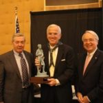 PAUL CHOQUETTE, left, chairman and CEO of Gilbane Building Co., and John C. Warren, right, chairman and CEO of The Washington Trust Company, present John F. Treanor, president and COO of Washington Trust, with the 2008 Sen. John H. Chafee Distinguished Citizen Award. / 