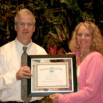 AUDODON SOCIETY EXECUTIVE DIRECTOR Lawrence Taft presents the 2008 Friend of Audubon Award to Elizabeth B. Eckel, senior vice president of marketing and investor relations at Washington Trust. / 