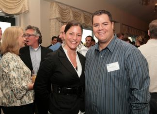 Amy Briggs and Anthony Bettencourt, both of Shazamm, enjoy the evening's cocktail reception. / PBN Photo