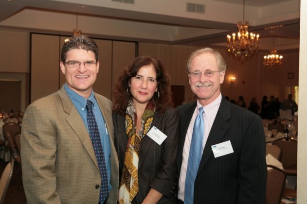 Jim Hanrahan(l), Joyce Rylander and Dave Dunbar, all of Providence Business News, enjoy the festivities. / PBN Photo