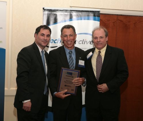 Dean Jeffrey Seeman, of the University of Rhode Island, accepts the Innovation Champion award on behalf of the R.I. Science and Technology Advisory Council (STAC). / PBN Photo