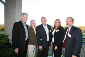 Elizabeth Pierotti (2nd from left), honored as an Innovation Champion, enjoys the late summer weather with other guests. / PBN Photo