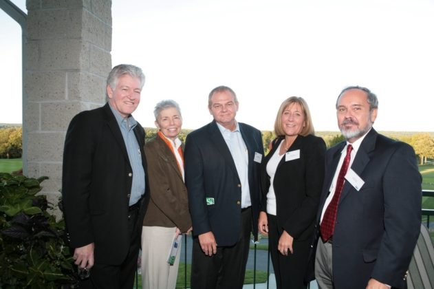 Elizabeth Pierotti (2nd from left), honored as an Innovation Champion, enjoys the late summer weather with other guests. / PBN Photo