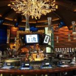 Mohegan’s latest addition blows in more business WORTH A GAMBLE: Among the features in the new 64,000-square-foot Casino of the Wind are a large circular bar, shown above, and a 42-table poker room. /