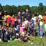 MEMBERS OF THE Boys & Girls Clubs of Providence South Side branch, with adults: William Beatini and Kobe Dennis, volunteers from the Boys & Girls Clubs, Jim Westervelt, recreation director of Plus One at Amgen, and Justin Waranis, volunteer from Boys & Girls Clubs. / 