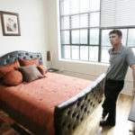 Rumford Center beginning to attract tenants CENTER OF ATTENTION: Development Manager John McMahon shows off the bedroom in one of the demo units in the Rumford Center project in East Providence. /