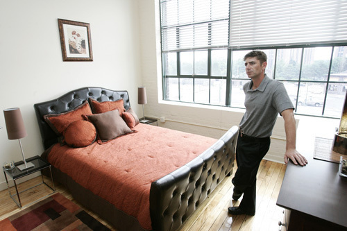 CENTER OF ATTENTION: Development Manager John McMahon shows off the bedroom in one of the demo units in the Rumford Center project in East Providence. / CENTER OF ATTENTION: Development Manager John McMahon shows off the bedroom in one of the demo units in the Rumford Center project in East Providence. /