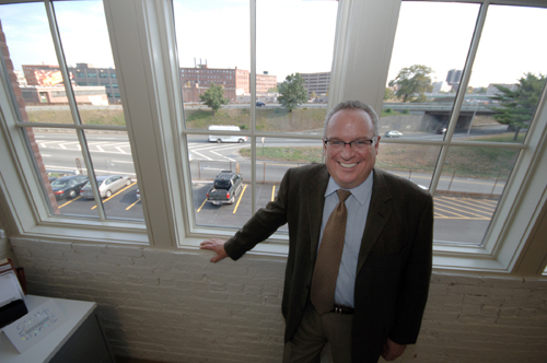ROOM TO GROW: Johnson & Wales University Vice President Christopher O. Placco hopes that the school can expand into land opened by the Interstate 195 – seen in the background – relocation. / ROOM TO GROW: Johnson & Wales University Vice President Christopher O. Placco hopes that the school can expand into land opened by the Interstate 195 – seen in the background – relocation. /