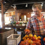 FIELD-TO-PLATE: Bruce Tillinghast, owner of New Rivers Restaurant, purchases fresh produce at Four Town Farm in Seekonk / 
