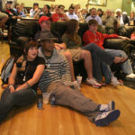 POLITICAL ACTION: Providence College students Sophia Georgeo and Hadrien Toure watch the final presidential debate. / 