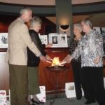 FROM LEFT: Ken Aker of Coventry, Marjorie Burke of Cumberland, Marie Mello of 
Pawtucket and Dori O’Sullivan of Warwick light the Flame of Hope to support The 
Cancer Center at Memorial Hospital of Rhode Island. / 