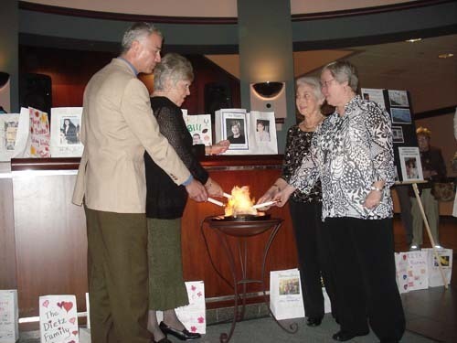 FROM LEFT: Ken Aker of Coventry, Marjorie Burke of Cumberland, Marie Mello of
Pawtucket and Dori O’Sullivan of Warwick light the Flame of Hope to support The
Cancer Center at Memorial Hospital of Rhode Island. / FROM LEFT: Ken Aker of Coventry, Marjorie Burke of Cumberland, Marie Mello of
Pawtucket and Dori O’Sullivan of Warwick light the Flame of Hope to support The
Cancer Center at Memorial Hospital of Rhode Island. /