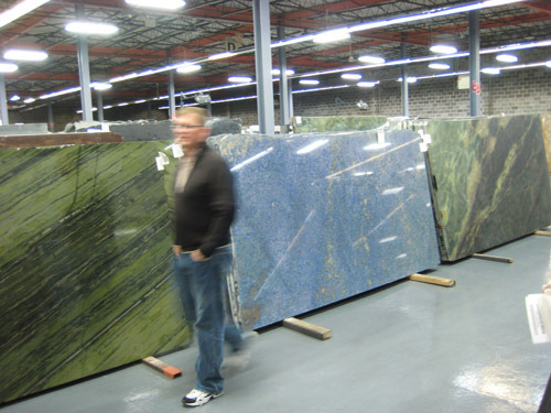 OWNER BARRY EYRE strolls through his company’s 40,000-square-foot, North Kingstown warehouse. / OWNER BARRY EYRE strolls through his company’s 40,000-square-foot, North Kingstown warehouse. /