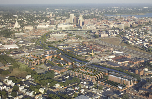 STANDING TALL: The ALCO complex is prominent in this artist’s depiction of what it will look like when completed. Work on the $300 million mixed-use project started in 2006. The 18.5-acre site includes the Nicholson File campus across the Woonasquatucket River. / STANDING TALL: The ALCO complex is prominent in this artist’s depiction of what it will look like when completed. Work on the $300 million mixed-use project started in 2006. The 18.5-acre site includes the Nicholson File campus across the Woonasquatucket River. /