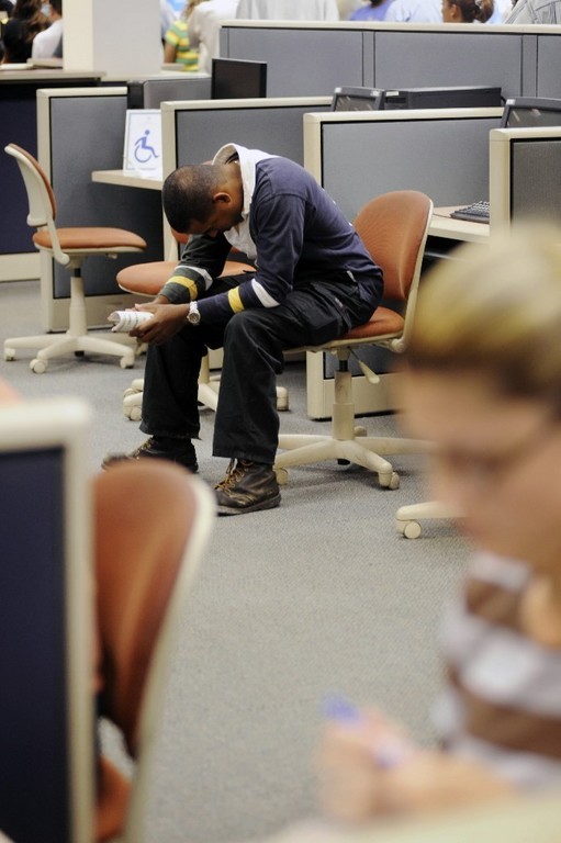 A JOB-SEEKER waits a chance to use a computer at the state Department of Labor job center in Gwinnett, Ga. Georgia had a September jobless rate of 6.3%, compared with the U.S. average of 6.1% and the Rhode Island rate of 8.8%. / A JOB-SEEKER waits a chance to use a computer at the state Department of Labor job center in Gwinnett, Ga. Georgia had a September jobless rate of 6.3%, compared with the U.S. average of 6.1% and the Rhode Island rate of 8.8%. /