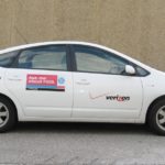 VERIZON BEGAN REPLACING its gasoline-powered cars with Toyota Prius hybrid sedans like this one late last year. / 