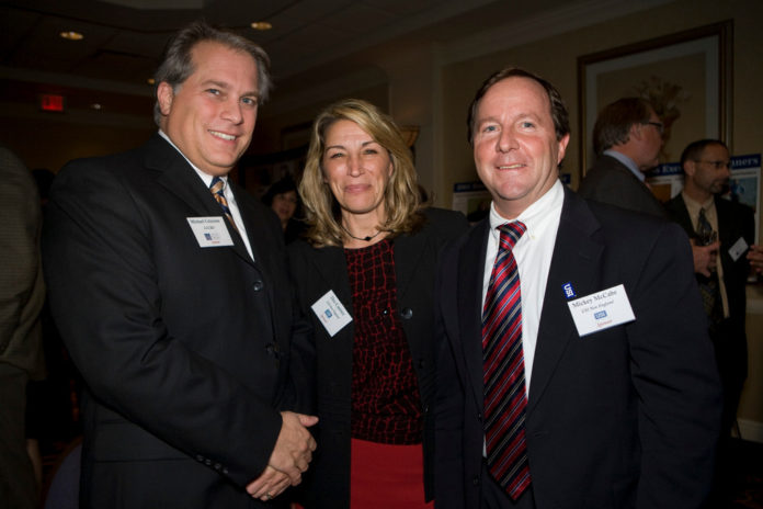 Michael Criscione(l), LGC&D, with Dee Canitez and Mickey McCabe from USI of New England. / PBN Photo/Victoria Arocho
