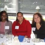 FROM LEFT: Representatives and students from Amos House enjoy dinner at Hemenway’s as part of their customer service training. Pictured are Geneva Johnson, Amos House culinary-education coordinator; Anita Roman, catering assistant and Jaqueline Mottola, student. / 