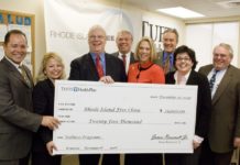 GOV. DONALD L. CARCIERI, center, attended the ceremonial presentation of a $25,000 donation from Tufts Health Plan to the Rhode Island Free Clinic. / 