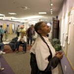 ANALYSTS BLAMED the effect of the Christmas and Hannukah holidays for the decline in new unemployment claims in the week ended Dec. 27. Above, Colorado resident Florine Wilburn, right, checks the job boards at a state Workforce Center in Denver earlier this month.  / 