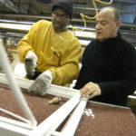 RIVERDALE Window & Doors President Ken Caito, right, first hired Carl Graham on work release in 2001. / 