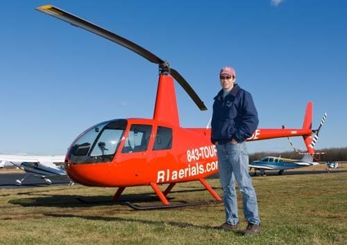 FLYING HIGH: Jeff Codman, owner of Bird’s Eye View Helicopters, located in Middletown, runs a helicopter-for-hire and aerial photo business at Newport State Airport. / FLYING HIGH: Jeff Codman, owner of Bird’s Eye View Helicopters, located in Middletown, runs a helicopter-for-hire and aerial photo business at Newport State Airport. /