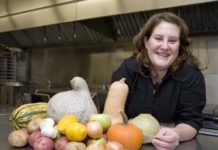 NOT SO GREEN ANYMORE: Soyna Bradford, owner of Green Gal Catering in Dartmouth, has honed her business acumen through the CWE’s Power Up! course. Here she’s in the Dartmouth Grange’s kitchen, where she often cooks. / 