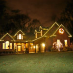 ‘Green’ holiday lights all the rage DECK THE HALLS: The East Greenwich home of Seth Wilson, general manager of SeaScape Lawn Care Inc., is decorated with a
mixture of LED lights and old-fashioned incandescent bulbs. /