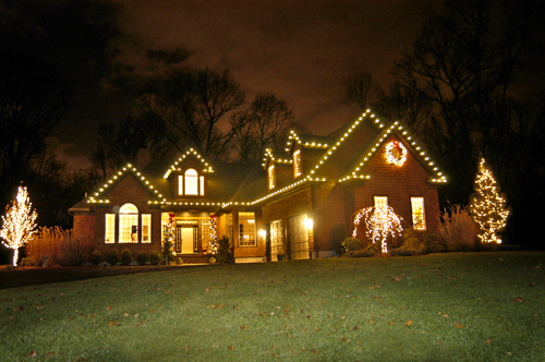 DECK THE HALLS: The East Greenwich home of Seth Wilson, general manager of SeaScape Lawn Care Inc., is decorated with a
mixture of LED lights and old-fashioned incandescent bulbs. / DECK THE HALLS: The East Greenwich home of Seth Wilson, general manager of SeaScape Lawn Care Inc., is decorated with a
mixture of LED lights and old-fashioned incandescent bulbs. /